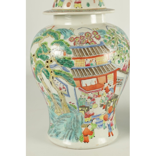 267 - A PAIR OF CHINESE REPUBLIC PORCELAIN VASES AND COVERS decorated wit brightly coloured figural scenes... 