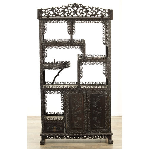 271 - A GOOD 19TH CENTURY CHINESE CARVED HARDWOOD DISPLAY CABINET with pierced and leaf-carved decoration ... 