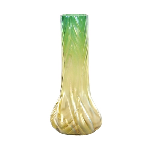 28 - AN ART NOUVEAU LOETZ TYPE IRIDESCENT GLASS VASE the stylish swirled base moulded body, with slender ... 