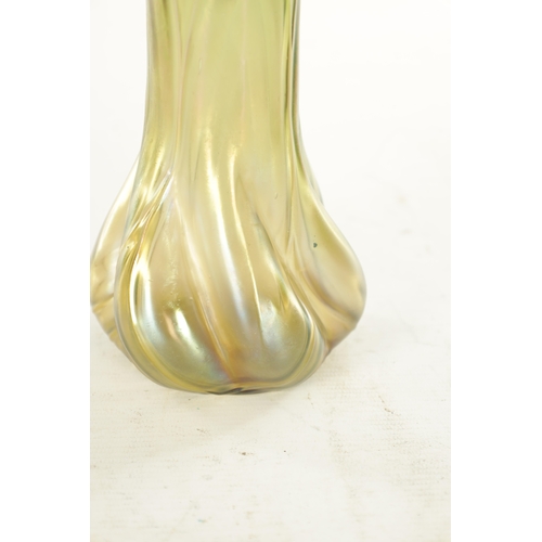 28 - AN ART NOUVEAU LOETZ TYPE IRIDESCENT GLASS VASE the stylish swirled base moulded body, with slender ... 