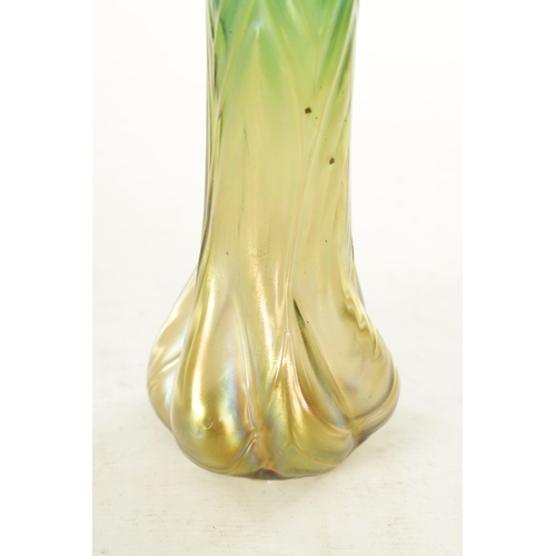 28 - AN ART NOUVEAU LOETZ TYPE IRIDESCENT GLASS VASE the stylish swirled base moulded body, with slender ... 