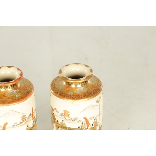 280 - A FINE PAIR OF JAPANESE MEIJI PERIOD SATSUMA CABINET VASES of cylindrical slender shape decorated wi... 