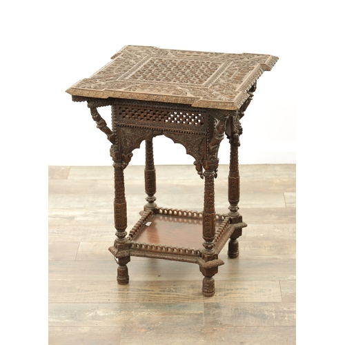 284 - A 19TH CENTURY INDIAN PROFUSELY CARVED HARDWOOD CENTRE TABLE the top with geometric flower head pane... 