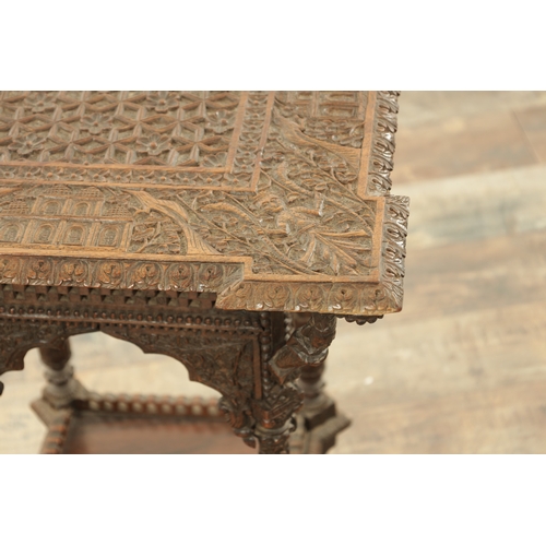 284 - A 19TH CENTURY INDIAN PROFUSELY CARVED HARDWOOD CENTRE TABLE the top with geometric flower head pane... 