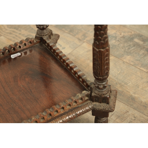 284 - A 19TH CENTURY INDIAN PROFUSELY CARVED HARDWOOD CENTRE TABLE the top with geometric flower head pane... 