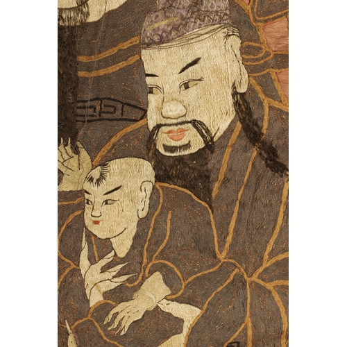 291 - AN 18TH/19TH CENTURY CHINESE SILK EMBROIDERED HANGING PANEL depicting elders with a child. (116cm hi... 