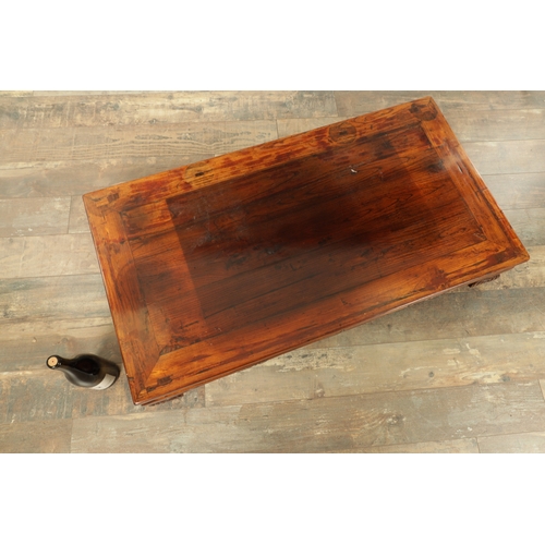 296 - A CHINESE STAINED ELM ALTER TABLE with panelled top above short-shaped scrolled feet (106cm wide 57c... 