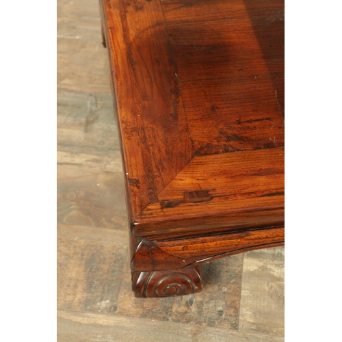 296 - A CHINESE STAINED ELM ALTER TABLE with panelled top above short-shaped scrolled feet (106cm wide 57c... 