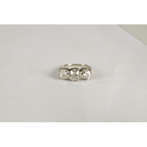 298 - A LADIES WHITE GOLD THREE STONE DIAMOND RING the three old cut diamonds 3.2ct, colour G-I, clarity V... 