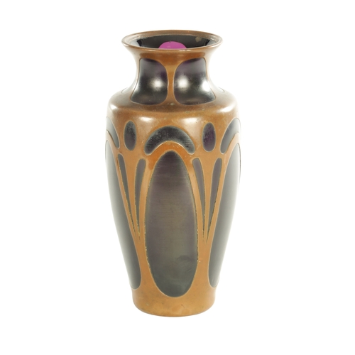 30 - AN ART NOVEAU COLOURED GLASS AND COPPER MOUNTED VASE ION THE MANNER OF LOETZ with copper clad stylis... 