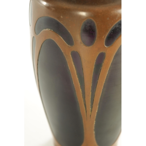 30 - AN ART NOVEAU COLOURED GLASS AND COPPER MOUNTED VASE ION THE MANNER OF LOETZ with copper clad stylis... 