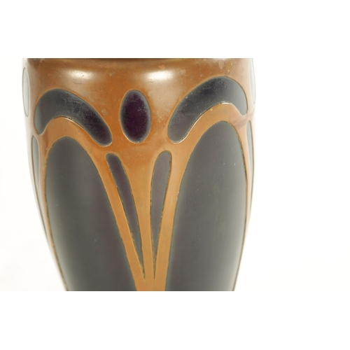 30 - AN ART NOVEAU COLOURED GLASS AND COPPER MOUNTED VASE ION THE MANNER OF LOETZ with copper clad stylis... 