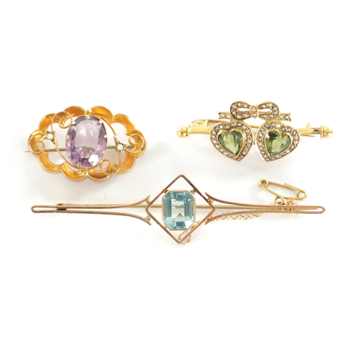 301 - A COLLECTION OF THREE VINTAGE 9CT GOLD BROOCHES comprising of a rose gold bar brooch with aquamarine... 