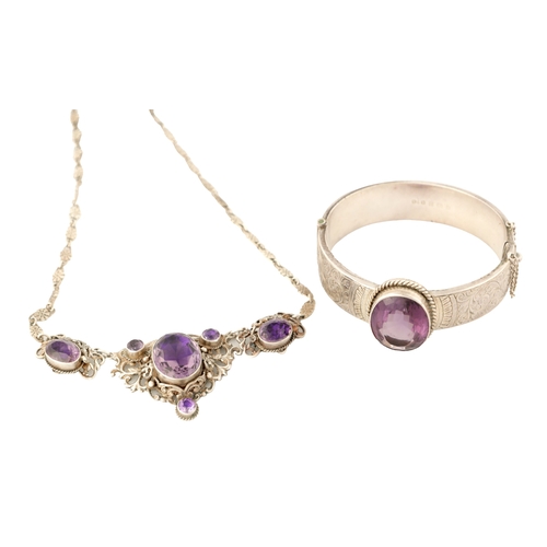 316 - A VINTAGE SILVER AND AMETHYST BANGLE AND PENDANT NECKLACE The bangle with scrollwork decoration and ... 