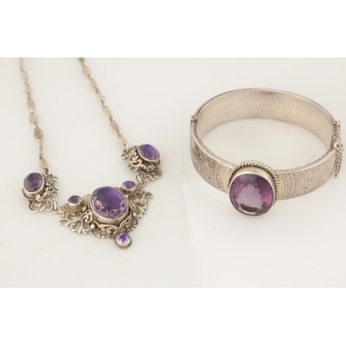 316 - A VINTAGE SILVER AND AMETHYST BANGLE AND PENDANT NECKLACE The bangle with scrollwork decoration and ... 