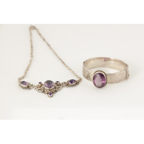 316 - A VINTAGE SILVER AND AMETHYST BANGLE AND PENDANT NECKLACE The bangle with scrollwork decoration and ... 