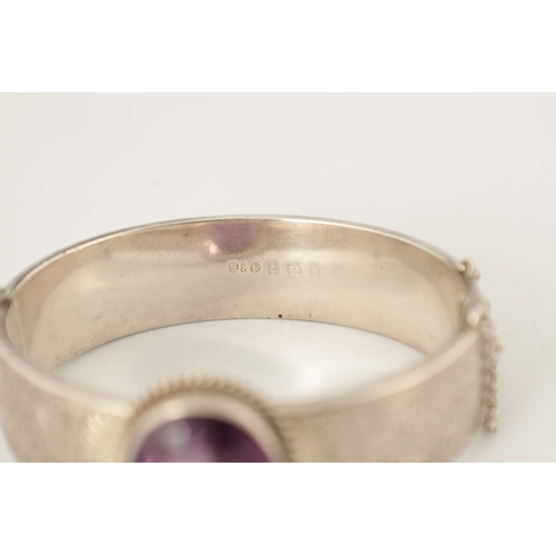 316 - A VINTAGE SILVER AND AMETHYST BANGLE AND PENDANT NECKLACE The bangle with scrollwork decoration and ... 