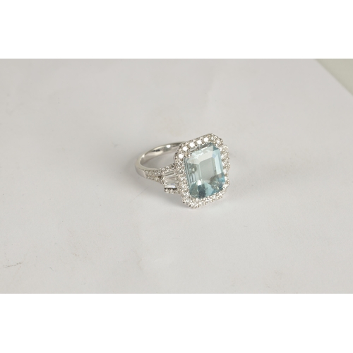 325 - A LADIES' 18CT WHITE GOLD AQUAMARINE AND DIAMOND RING the large emerald cut aquamarine app. 6ct surr... 