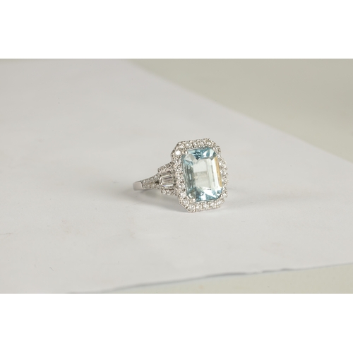 325 - A LADIES' 18CT WHITE GOLD AQUAMARINE AND DIAMOND RING the large emerald cut aquamarine app. 6ct surr... 