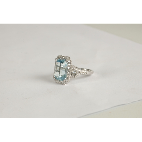 325 - A LADIES' 18CT WHITE GOLD AQUAMARINE AND DIAMOND RING the large emerald cut aquamarine app. 6ct surr... 