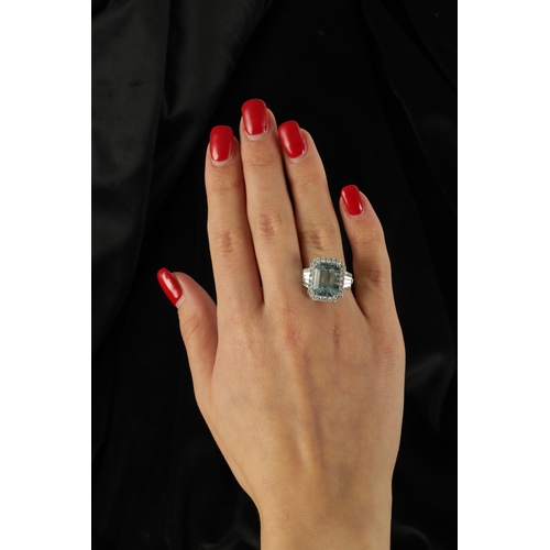 325 - A LADIES' 18CT WHITE GOLD AQUAMARINE AND DIAMOND RING the large emerald cut aquamarine app. 6ct surr... 