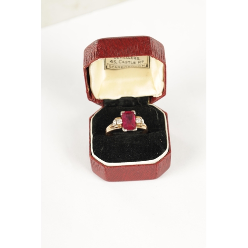 326 - A LADIES 15CT ROSE GOLD RUBY AND DIAMOND RING, having a baguette cut ruby set in a white gold mount ... 