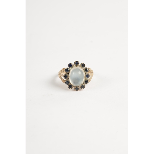 328 - A LADIES 9CT GOLD CABOCHON MOONSTONE AND SAPPHIRE RING total weight app. 3.5g (Moonstone measures 11... 