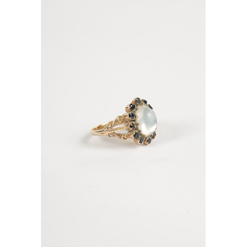 328 - A LADIES 9CT GOLD CABOCHON MOONSTONE AND SAPPHIRE RING total weight app. 3.5g (Moonstone measures 11... 