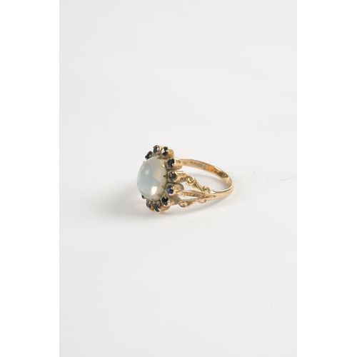 328 - A LADIES 9CT GOLD CABOCHON MOONSTONE AND SAPPHIRE RING total weight app. 3.5g (Moonstone measures 11... 