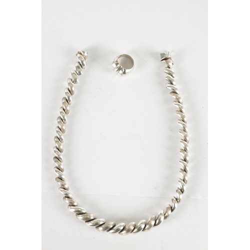 329 - A CHUNKY SILVER NECKLACE TOGETHER WITH A SILVER RING, total weight 98g. (Chain length is 46cm)