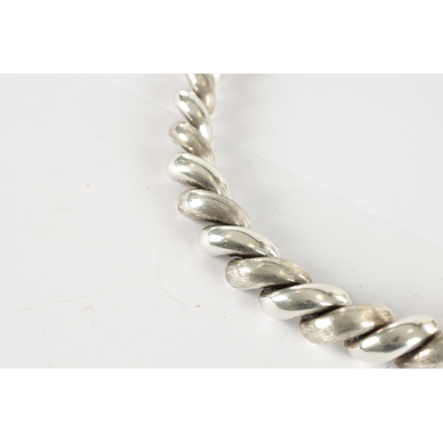 329 - A CHUNKY SILVER NECKLACE TOGETHER WITH A SILVER RING, total weight 98g. (Chain length is 46cm)