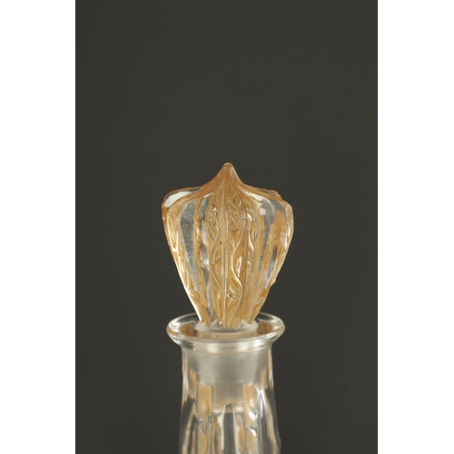 33 - AN R LALIQUE SIX-FIGURINE AMBER STAINED GLASS DECANTER of angled form and decorated with carved pane... 