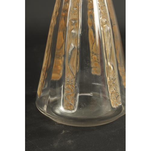 33 - AN R LALIQUE SIX-FIGURINE AMBER STAINED GLASS DECANTER of angled form and decorated with carved pane... 