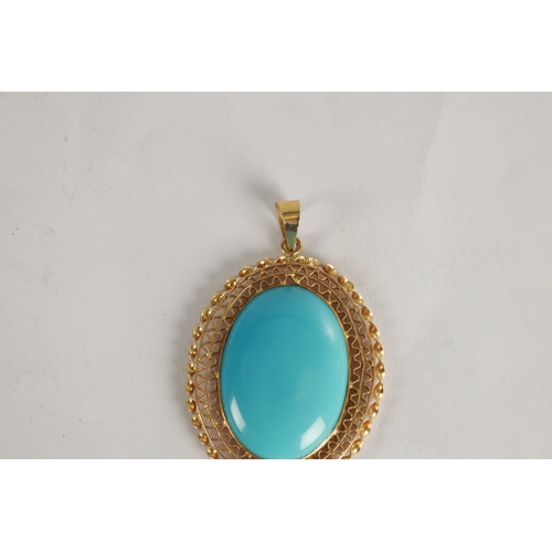 332 - A LADIES' 18CT GOLD CABOCHON TURQUOISE OVAL PENDANT the large stone set in a filigree frame with loo... 