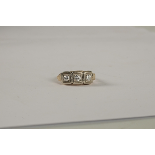 335 - A LADIES 9CT GOLD THREE STONE DIAMOND RING the old cut diamonds set in square white gold frames on p... 
