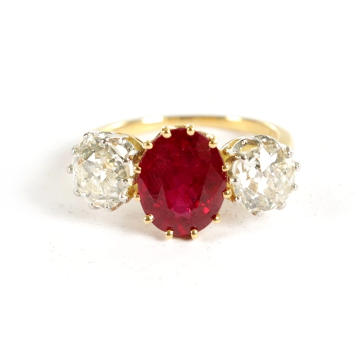 339 - A FINE 18CT YELLOW GOLD RUBY AND TWO-STONE DIAMOND RING straight set with oval centre facet-cut ruby... 