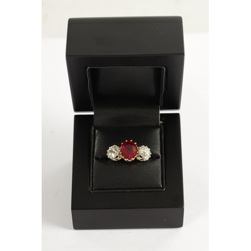 339 - A FINE 18CT YELLOW GOLD RUBY AND TWO-STONE DIAMOND RING straight set with oval centre facet-cut ruby... 