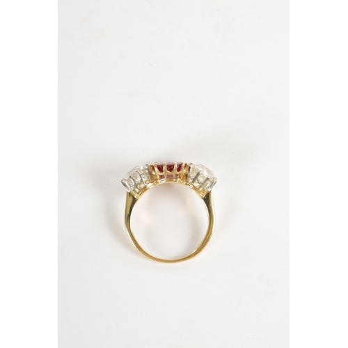 339 - A FINE 18CT YELLOW GOLD RUBY AND TWO-STONE DIAMOND RING straight set with oval centre facet-cut ruby... 