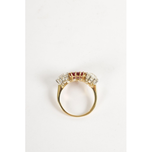 339 - A FINE 18CT YELLOW GOLD RUBY AND TWO-STONE DIAMOND RING straight set with oval centre facet-cut ruby... 