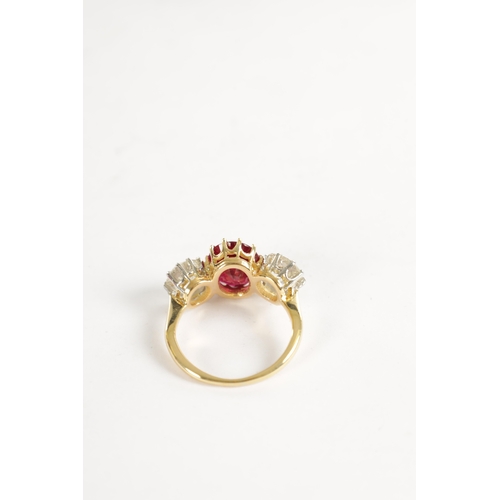 339 - A FINE 18CT YELLOW GOLD RUBY AND TWO-STONE DIAMOND RING straight set with oval centre facet-cut ruby... 