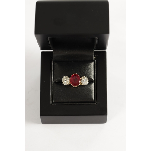 339 - A FINE 18CT YELLOW GOLD RUBY AND TWO-STONE DIAMOND RING straight set with oval centre facet-cut ruby... 