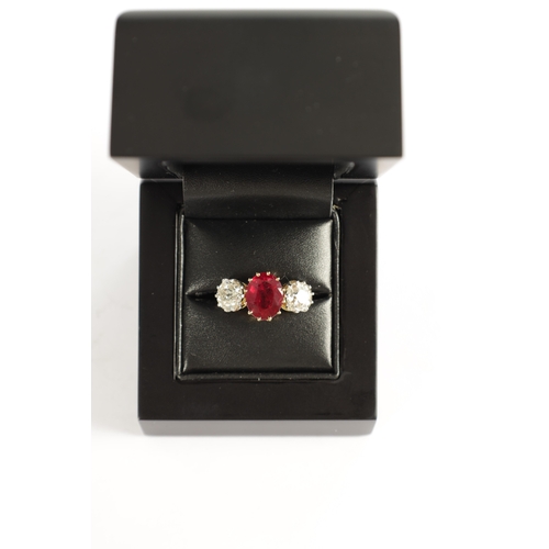 339 - A FINE 18CT YELLOW GOLD RUBY AND TWO-STONE DIAMOND RING straight set with oval centre facet-cut ruby... 