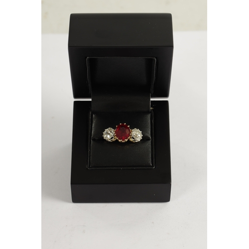 339 - A FINE 18CT YELLOW GOLD RUBY AND TWO-STONE DIAMOND RING straight set with oval centre facet-cut ruby... 