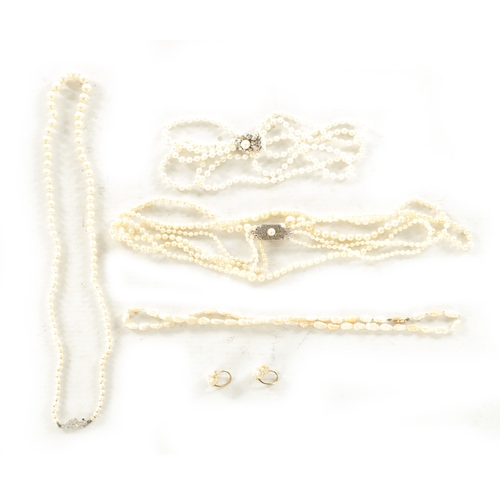 342 - A COLLECTION OF FOUR PEARL NECKLACES AND A PAIR OF EARRINGS one with a 9ct white gold and diamond cl... 