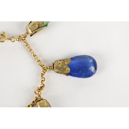 343 - A LATE 19TH CENTURY GOLD METAL BRACELET WITH HARD STONE DROPS having jade stones mounted on a gold c... 