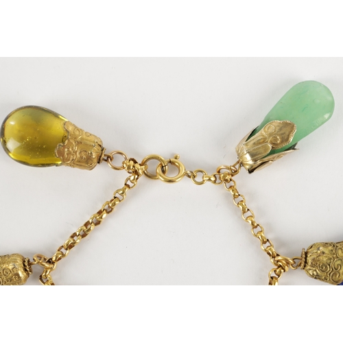 343 - A LATE 19TH CENTURY GOLD METAL BRACELET WITH HARD STONE DROPS having jade stones mounted on a gold c... 