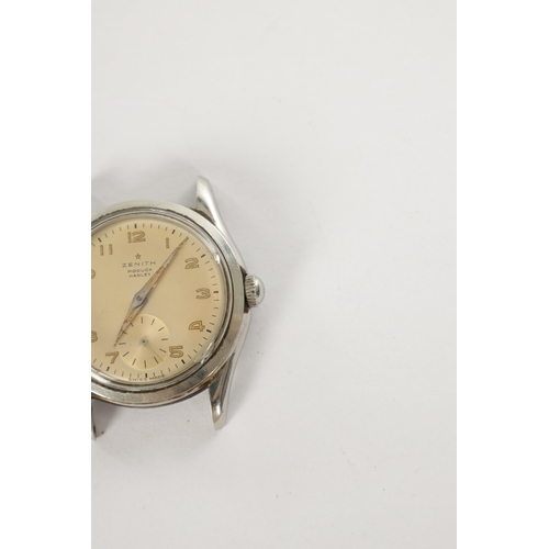 362 - A VINTAGE STAINLESS STEEL ZENITH WRIST WATCH having a screw back case enclosing a champagne dial wit... 