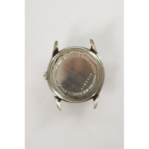 362 - A VINTAGE STAINLESS STEEL ZENITH WRIST WATCH having a screw back case enclosing a champagne dial wit... 