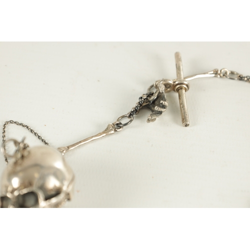 374 - A 19TH CENTURY SILVER SKULL FOB POCKET WATCH CHAIN with bones and a hinged skull vesta. (33cm long)