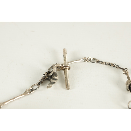 374 - A 19TH CENTURY SILVER SKULL FOB POCKET WATCH CHAIN with bones and a hinged skull vesta. (33cm long)